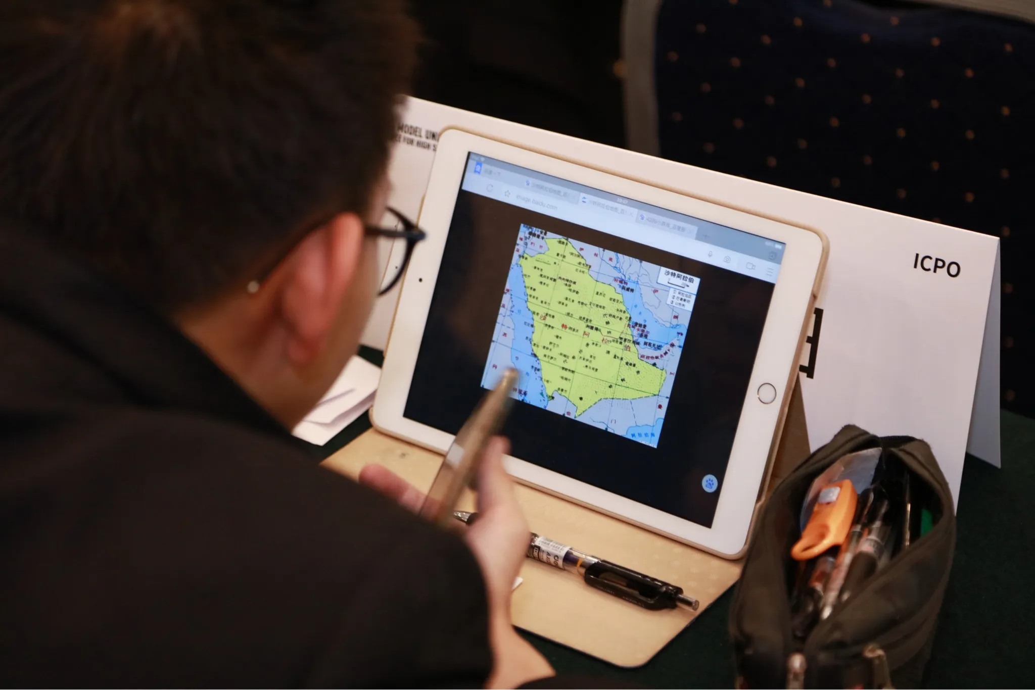 Delegate studying map